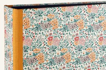 folder with scattered flowers, spine reinforced with orange linen edges